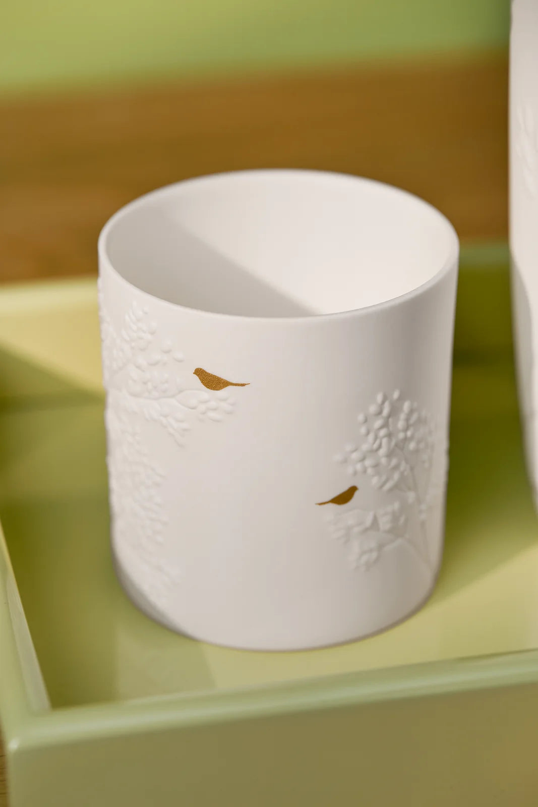 Porcelain light golden bird D.6.5cm H.7cm
